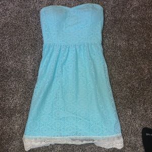 A small lace blue strapless dress